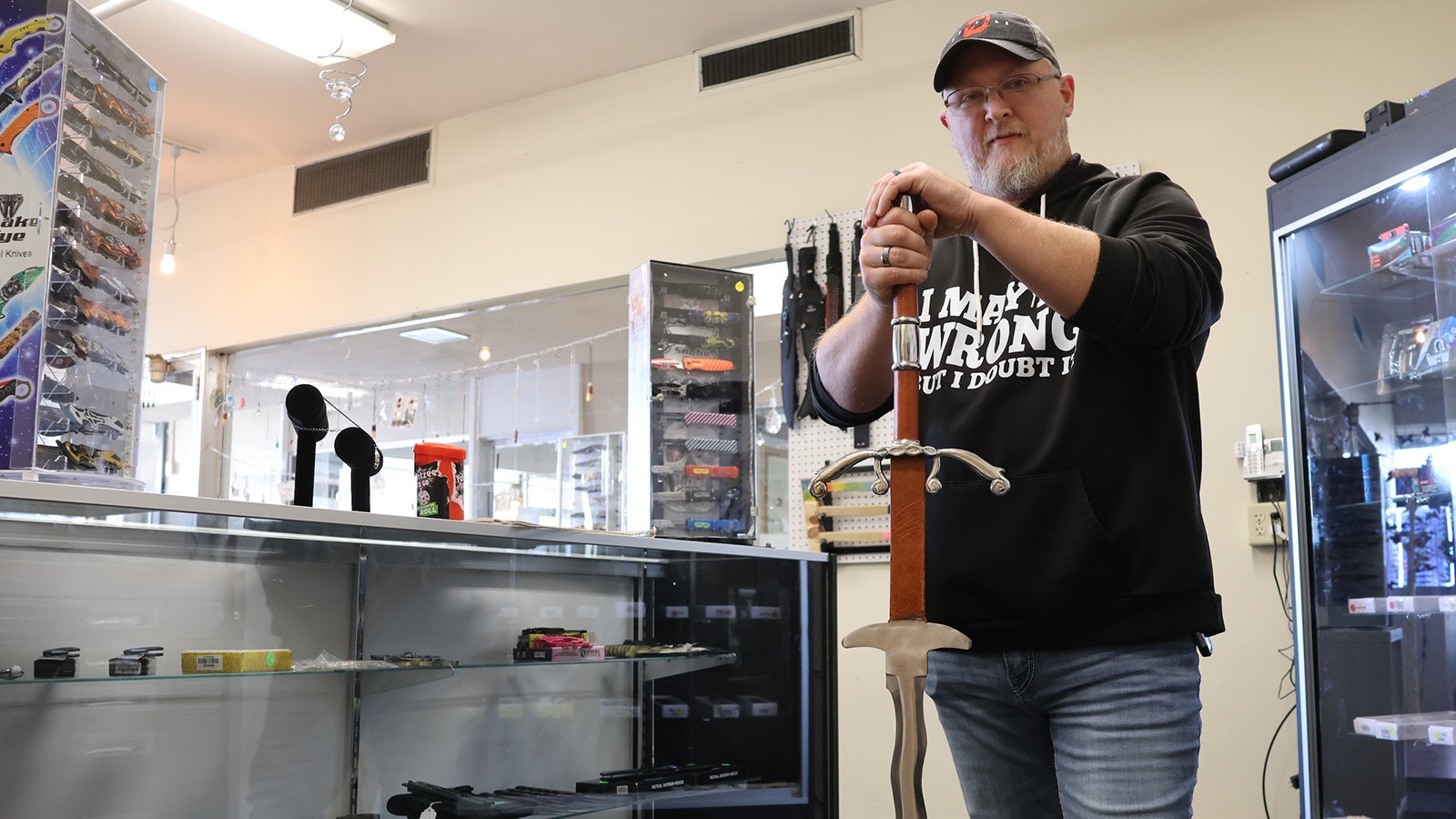 Charlie Lee holds a 5-foot-long flamberge sword that is offered at his shop.