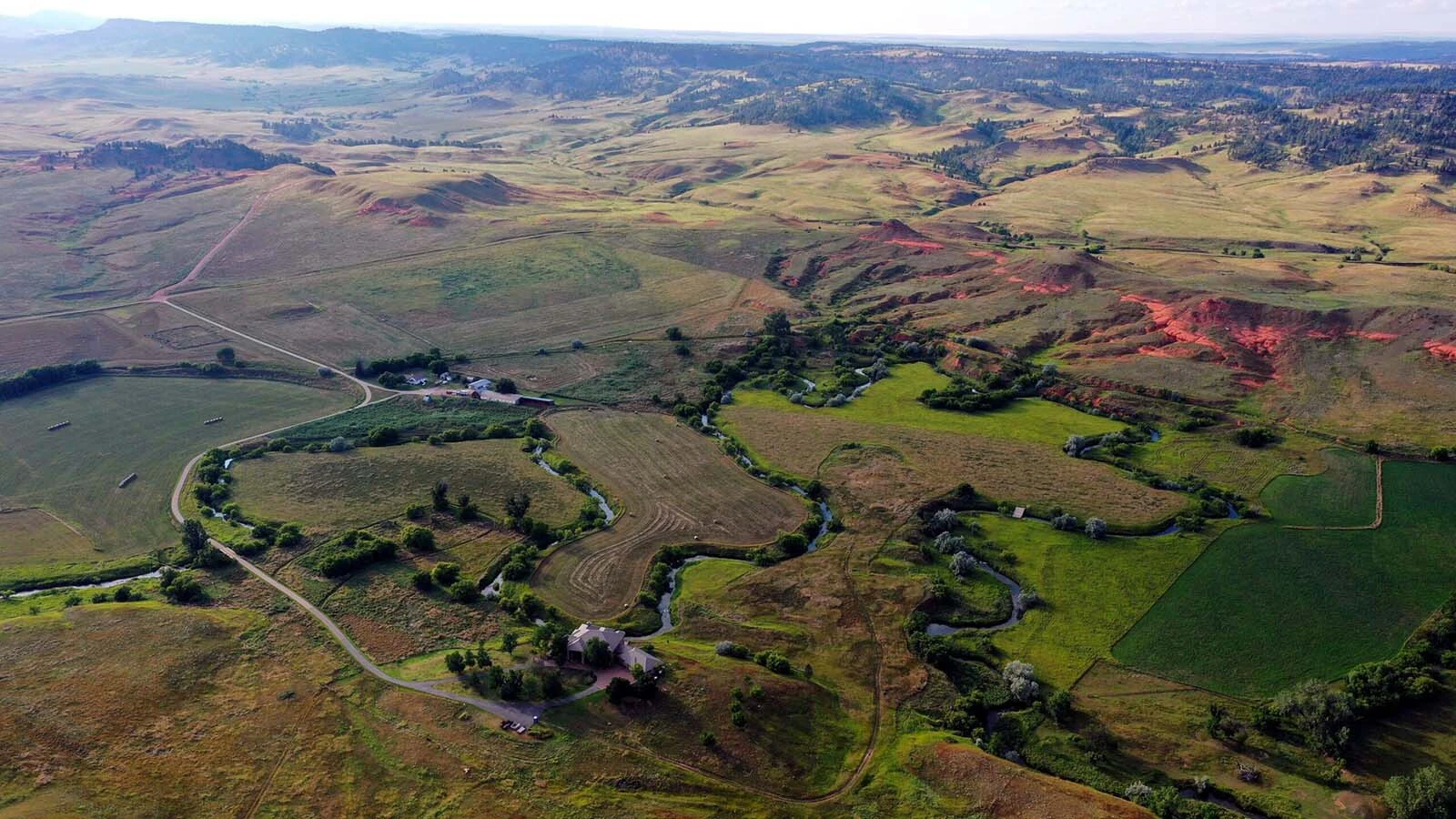 A Crook County ranch with almost a century of history has hit the market for $5 million. It comes with a historic homestead, 7,500-square-foot mansion, a trout stream, views of red bluffs and access to the Black Hills of Wyoming and South Dakota. 