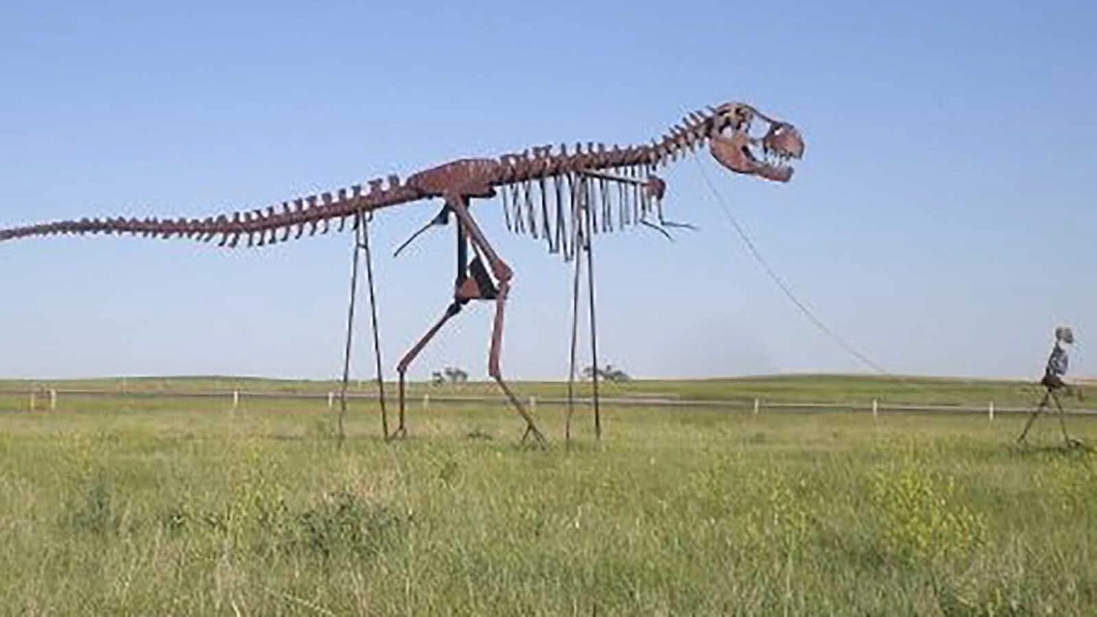 For decades, motorists speeding down Interstate 90 in west-central South Dakota have done double takes at a towering human skeleton leading a T. rex on a leash. It’s a quirky prairie creation born from one man’s lifelong dream to build his own dinosaur.