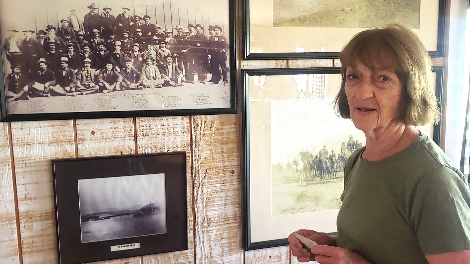 Barbara Madsen starts her history tour at the TA Ranch at the photo wall.