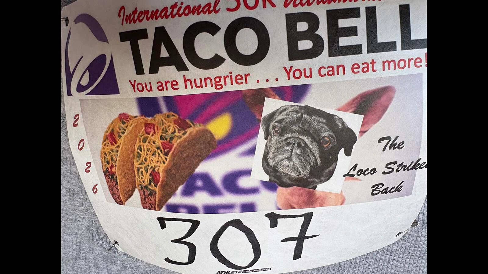 Runners can write anything on their bibs at the Taco Bell Ultramarathon in Denver. Clair McFarland wrote "307" and took her place next to "Chalupa Baby" and "Chunks."