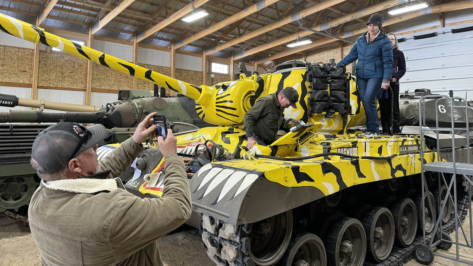 Visitors enjoy exploring a M46 Patton tank in the parade vehicle facility in the National Museum of Military Vehicles.