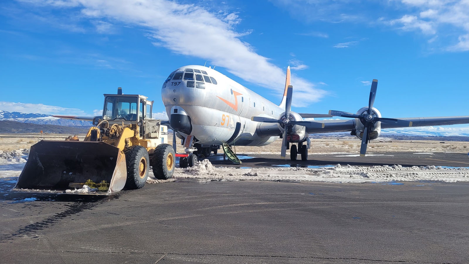 It took a team effort to move this Boeing KC-97 tanker to the grounds of the Museum of Flight and Aerial Firefighting, the Wyoming museum's largest aircraft. They had to wait for a cold snap so the ground would be frozen enough for the huge tanker to roll without sinking into the ground.