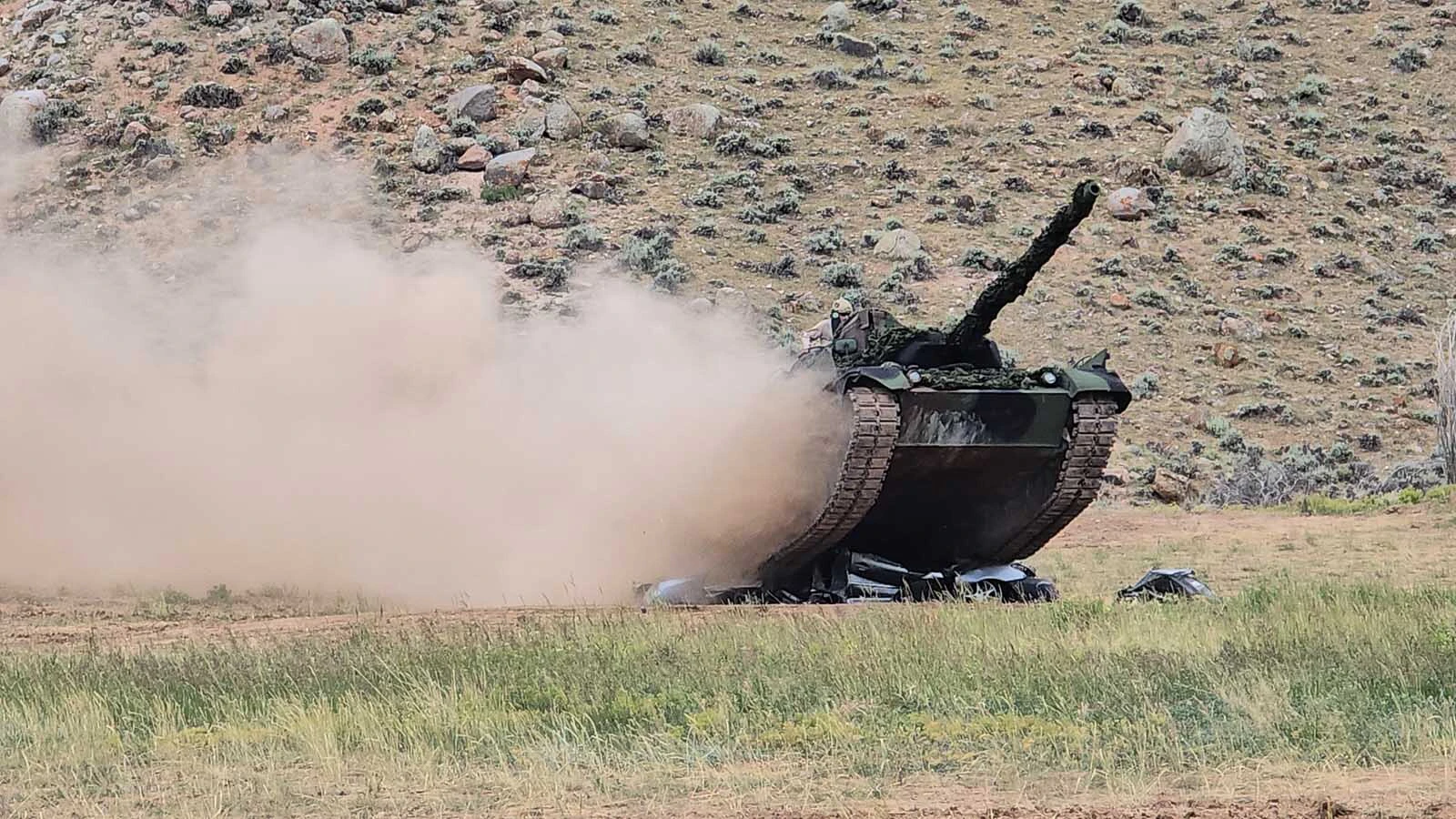 The Leopard tank is just making sure this white car is flatter than a pancake.