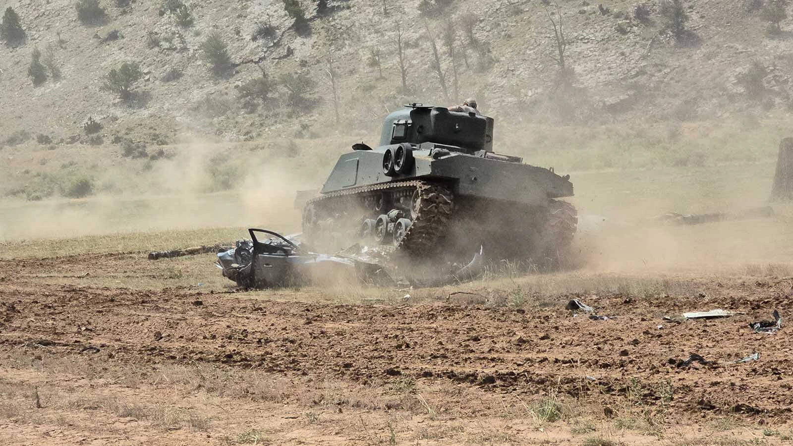 The M4 comes out for a turn at the two crushed cars.