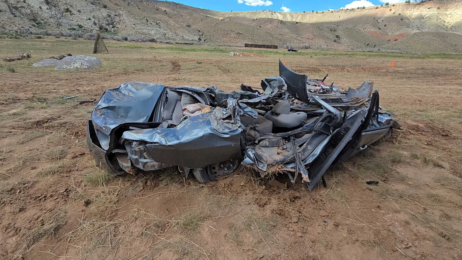 The twisted wreckage of a vehicle crushed by a tank. It only took two or three passes to produce this result.
