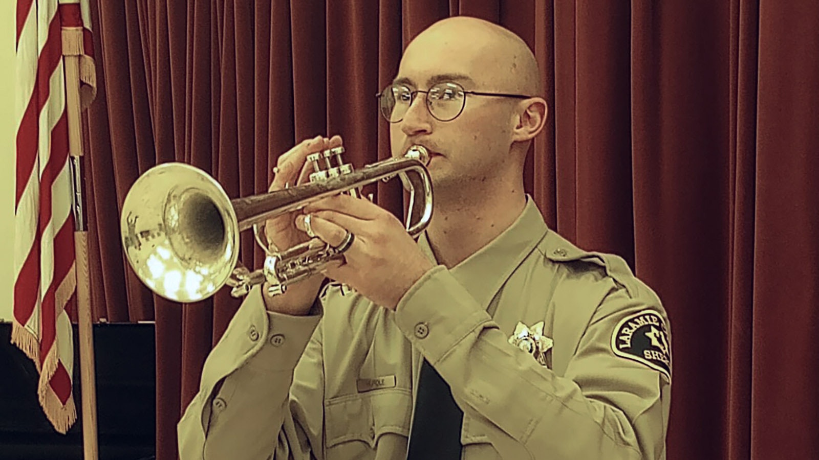 Laramie County Sheriff's Office Deputy Peter Hurdle will pay taps for Sheridan police Sgt. Nevada Krinkee.