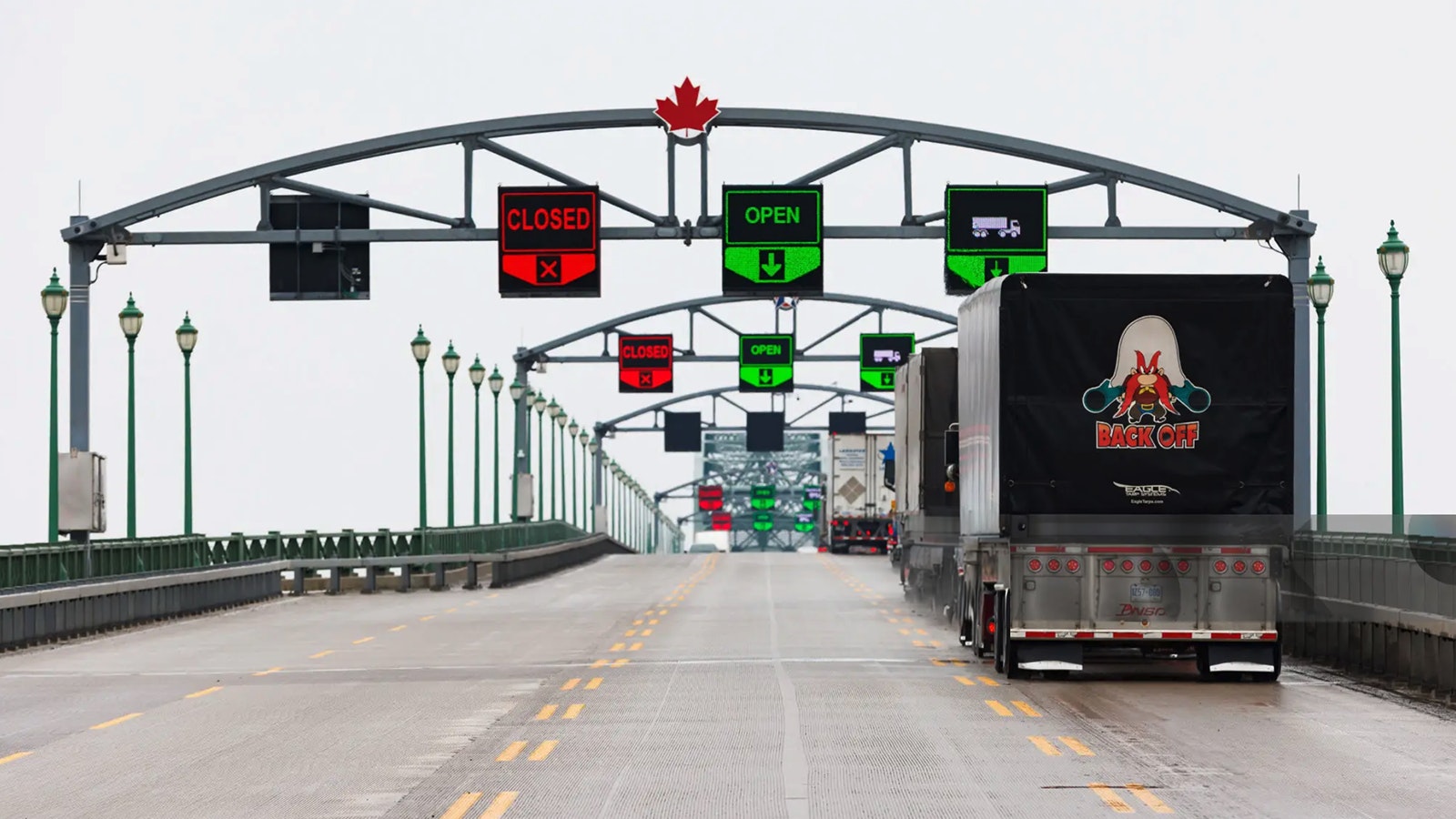 Semitrucks cross the Peace Bridge at the U.S.-Canada border in Fort Erie, Ontario, Canada, on Monday, Feb. 3, 2025. After Canada agreed to implement border security measures, President Donald Trump paused his proposed tariffs for 30 days.