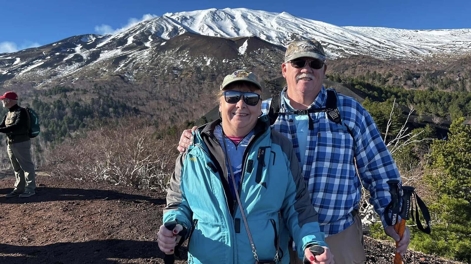 Donna and Eric Crock in Sicily, hiking Mount Etna in 2024.