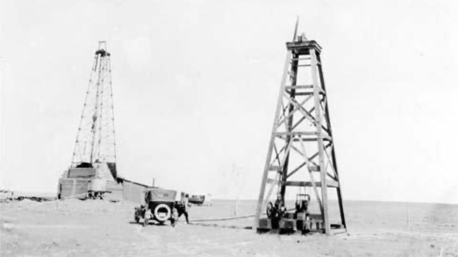 A Teapot Dome water and oil well sit side-by-side in the early days of the field’s development.