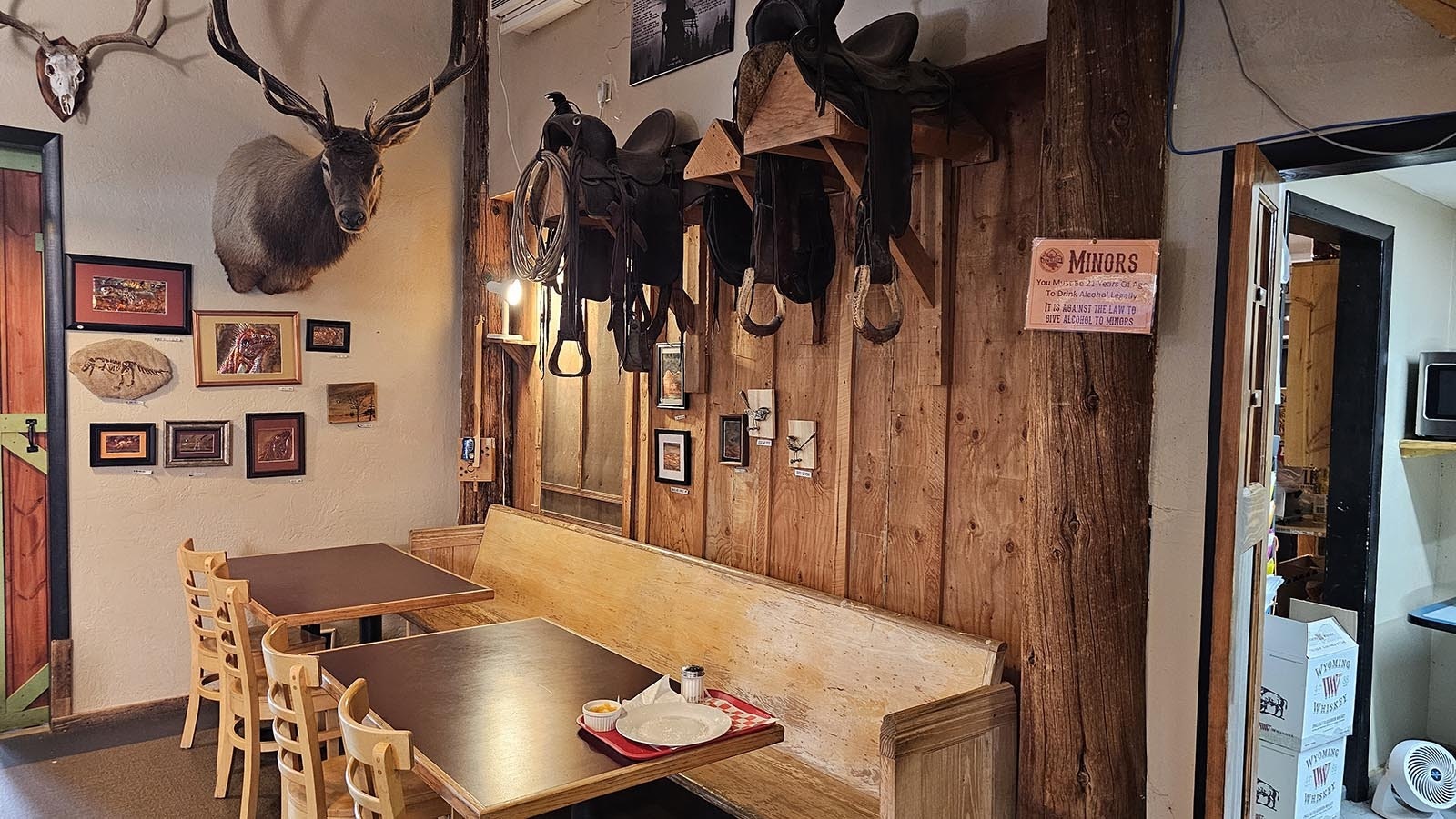 Saddles, trophies, and other memorabilia decorate the walls at Ten Sleep Brewery.