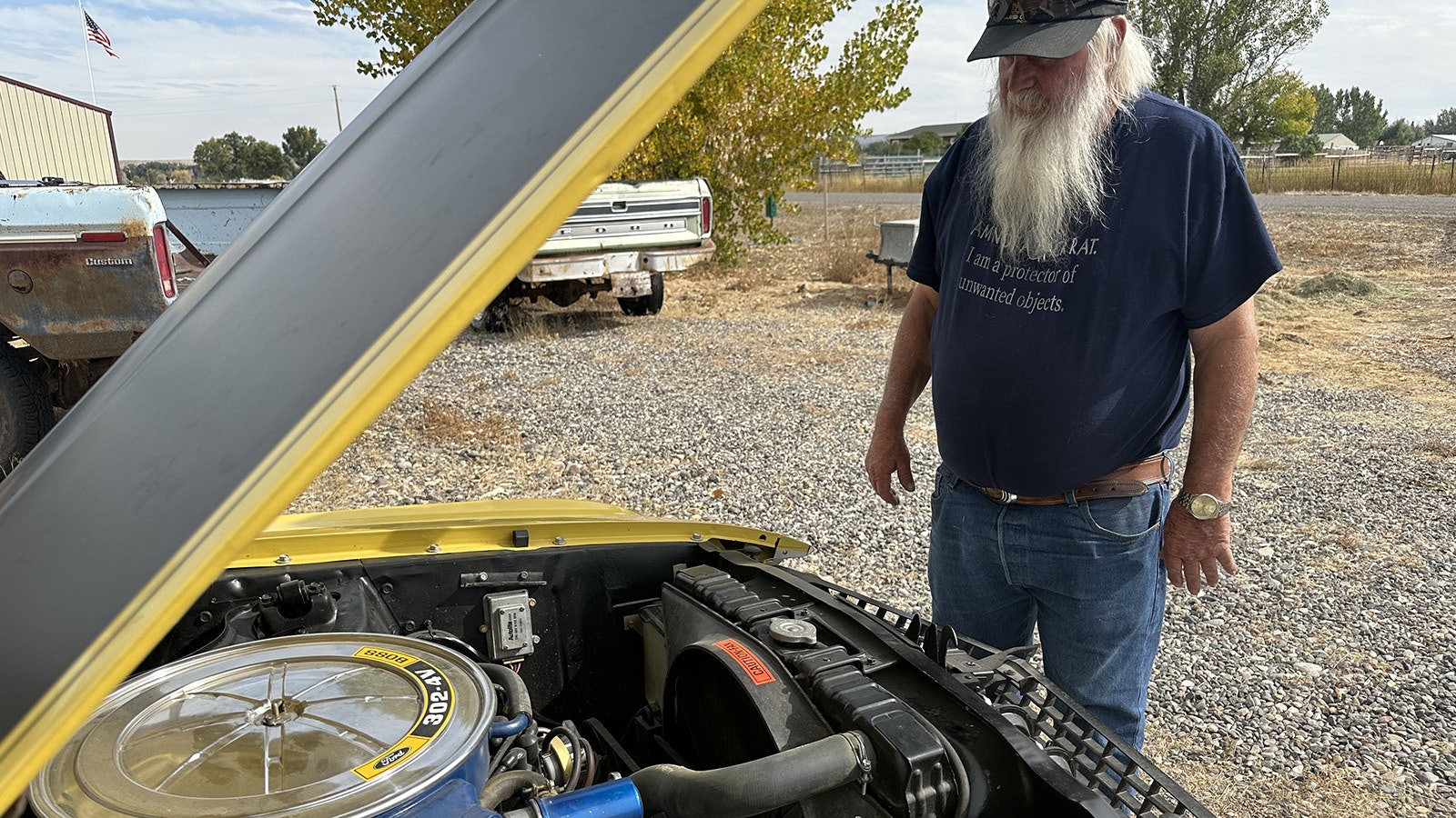 David Francis looks under the hood of his restored 1969 Mustang. He wrecked the car in 1970 during the Ten Sleep Canyon Hill Climb in Wyoming.