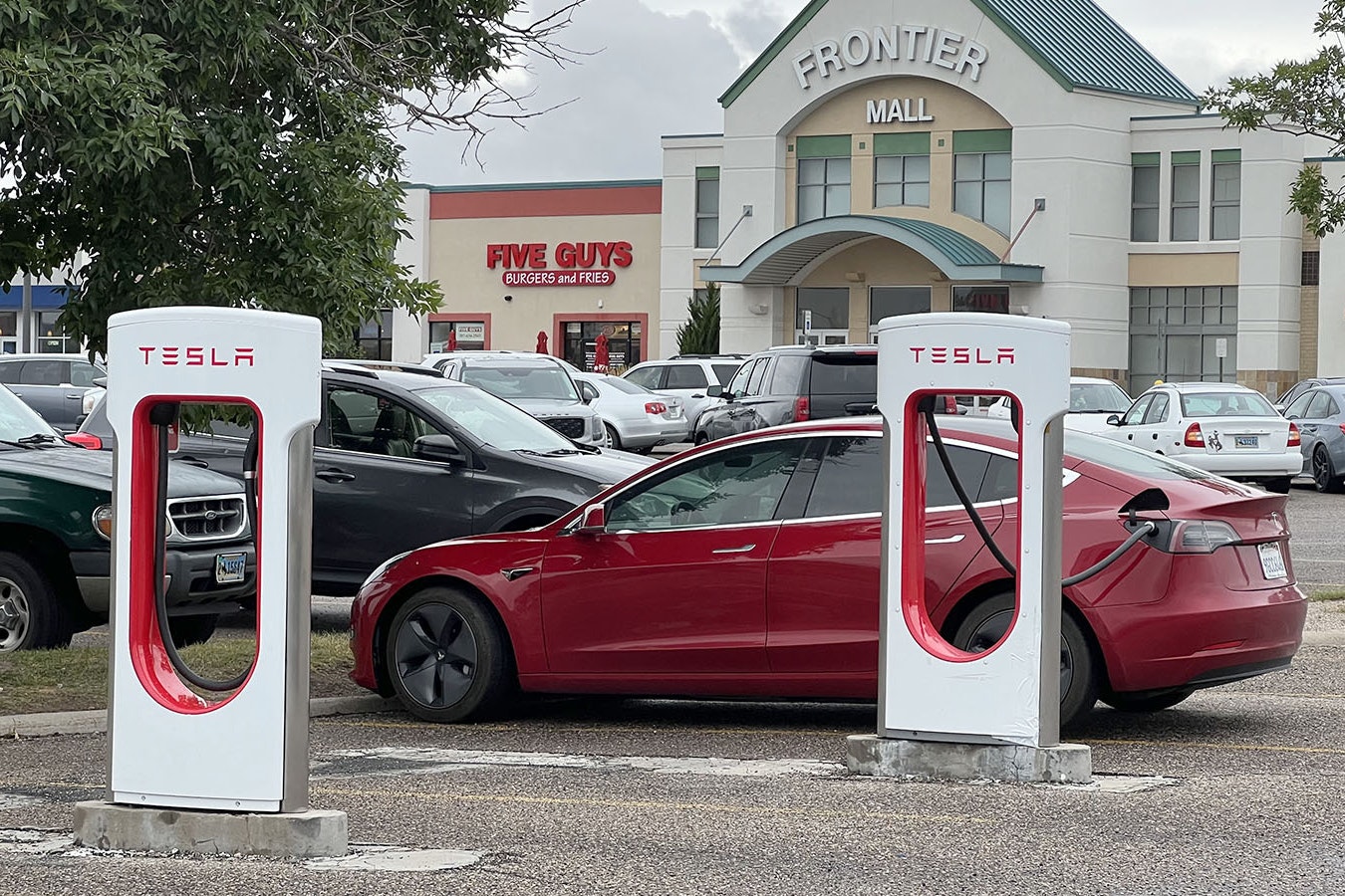 A Tesla juices up at a level 3 fast-charging station at the Frontier Mall in Cheyenne.