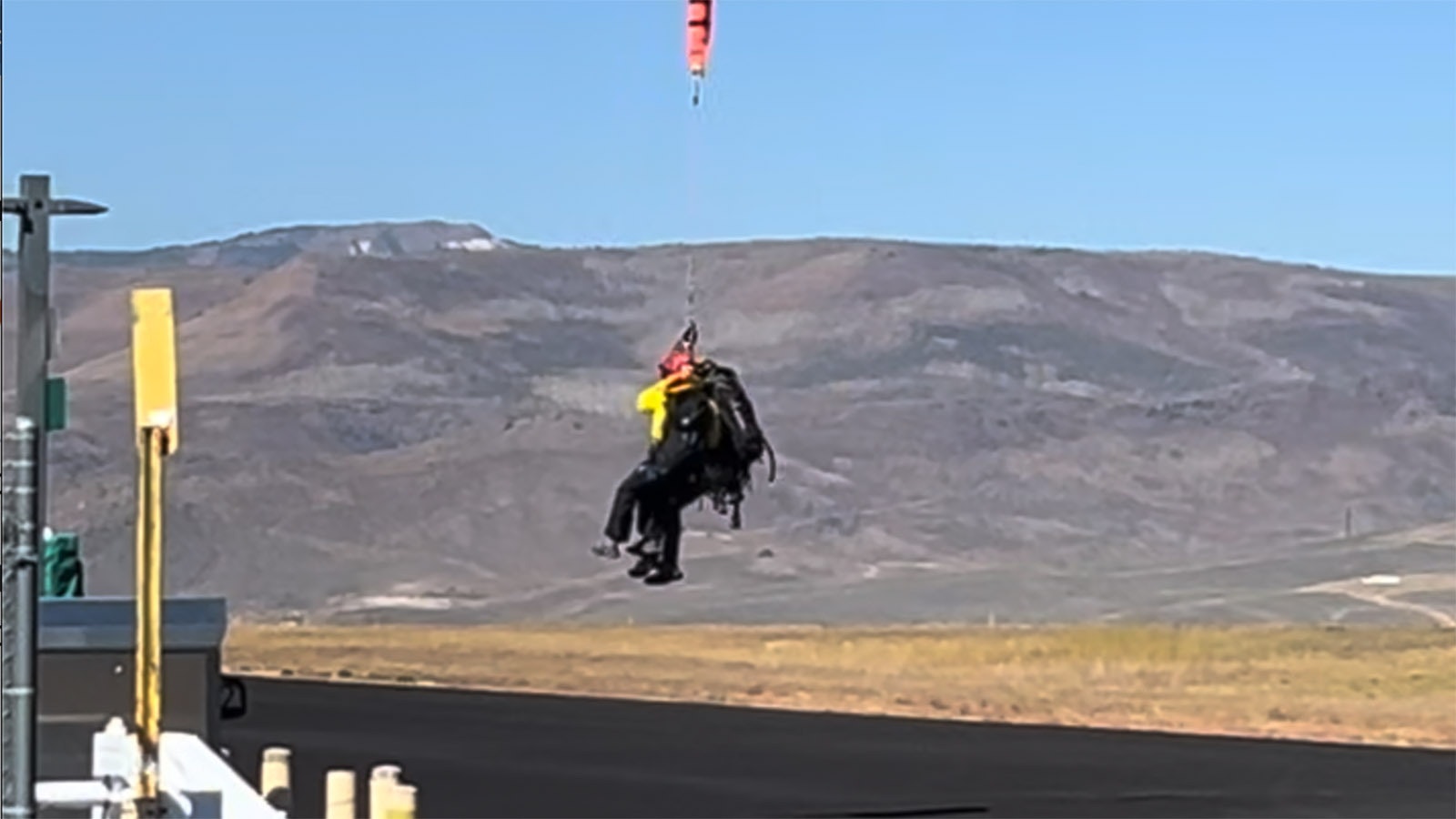 A 250-foot line suspended from a Teton County Search and Rescue helicopter was used to recover a man’s body from a remote Colorado Peak. Jenny Lake Climbing Rangers from Grand Teton National Park were attached to the line.