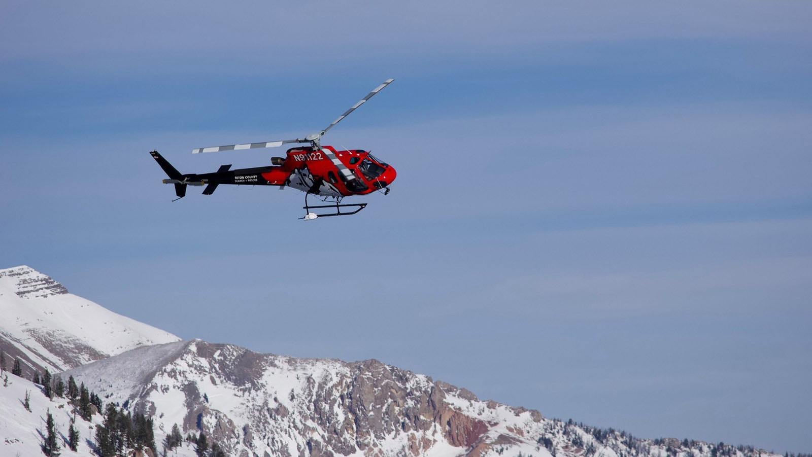 A Teton County Search and Rescue helicopter on its way to Prater Canyon to retrieve a skier caught in an avalanche.