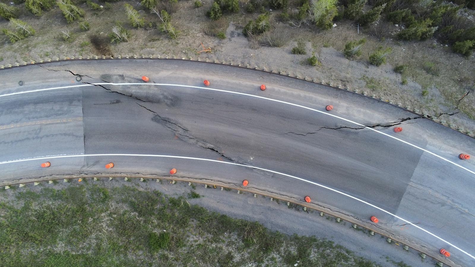 Cracks at milepost 12.8 signalled the beginning of the slip. The darker color of this section of road clearly show where previous patchwork was done.