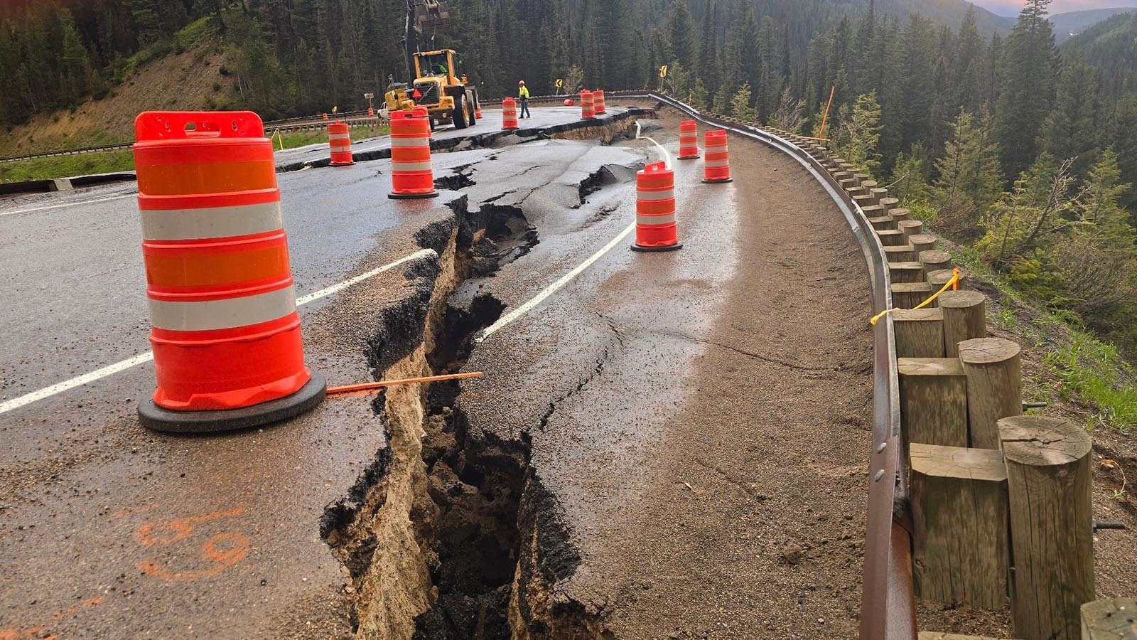 Huge cracks had formed at milepost 12.8 of Highway 22 over Teton Pass on Friday, June 7, 2024, hours before it failed completely, with a whole section of the highway sliding down the mountain.