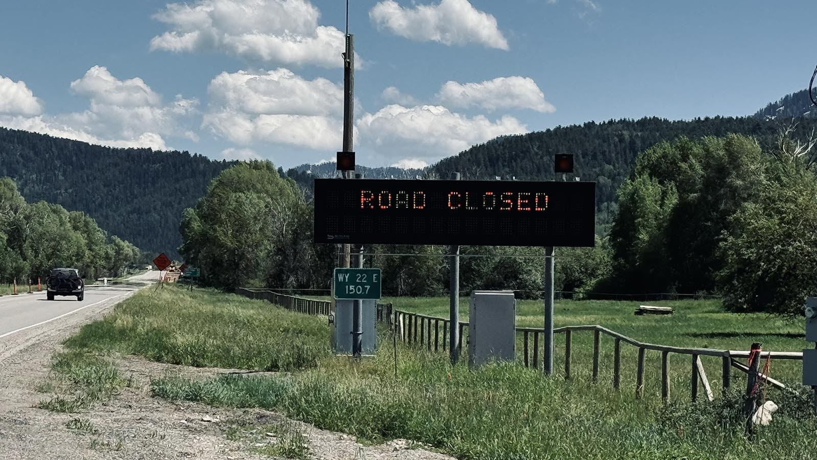 A Wyoming Department of Transportation sign warns drivers to stop at the Wyoming and Idaho border due to the landslide that crippled Wyoming State Route 22 through the Teton Pass.