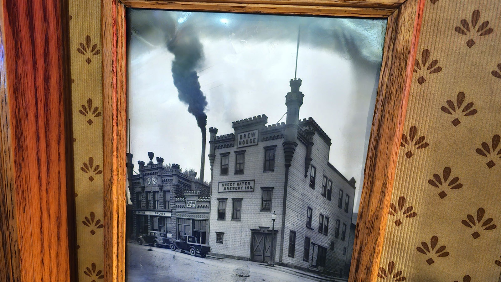 An old photograph on the wall that shows what The Brewery used to look like when it was still three buildings.