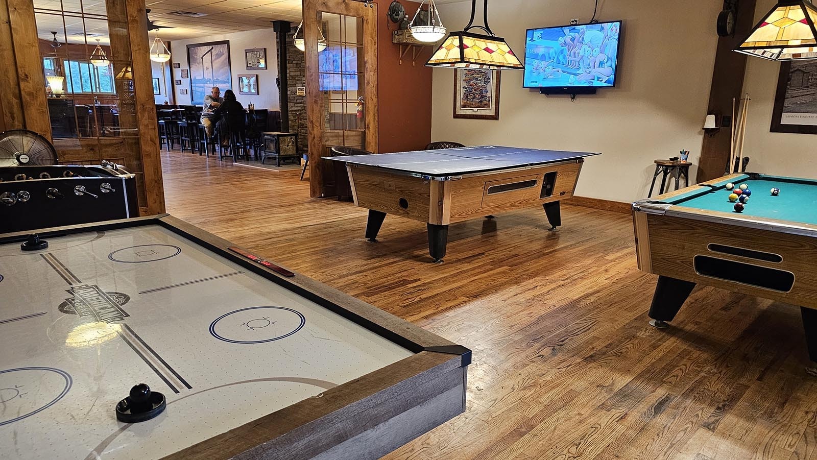 Pool tables and other games await at The Divide Restaurant & Lounge.