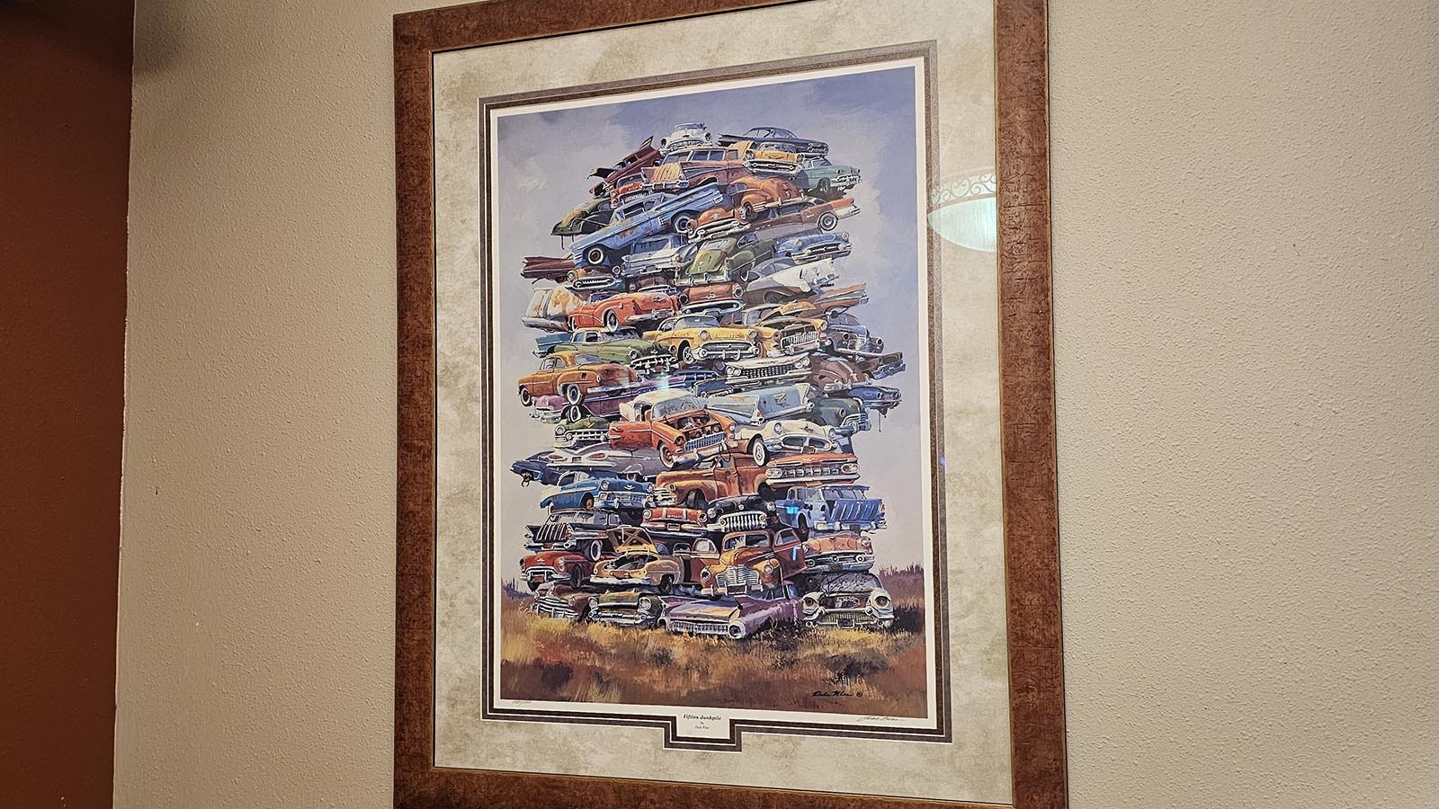 A tower of classic cars is among artwork on the walls at The Divide Restaurant & Lounge.