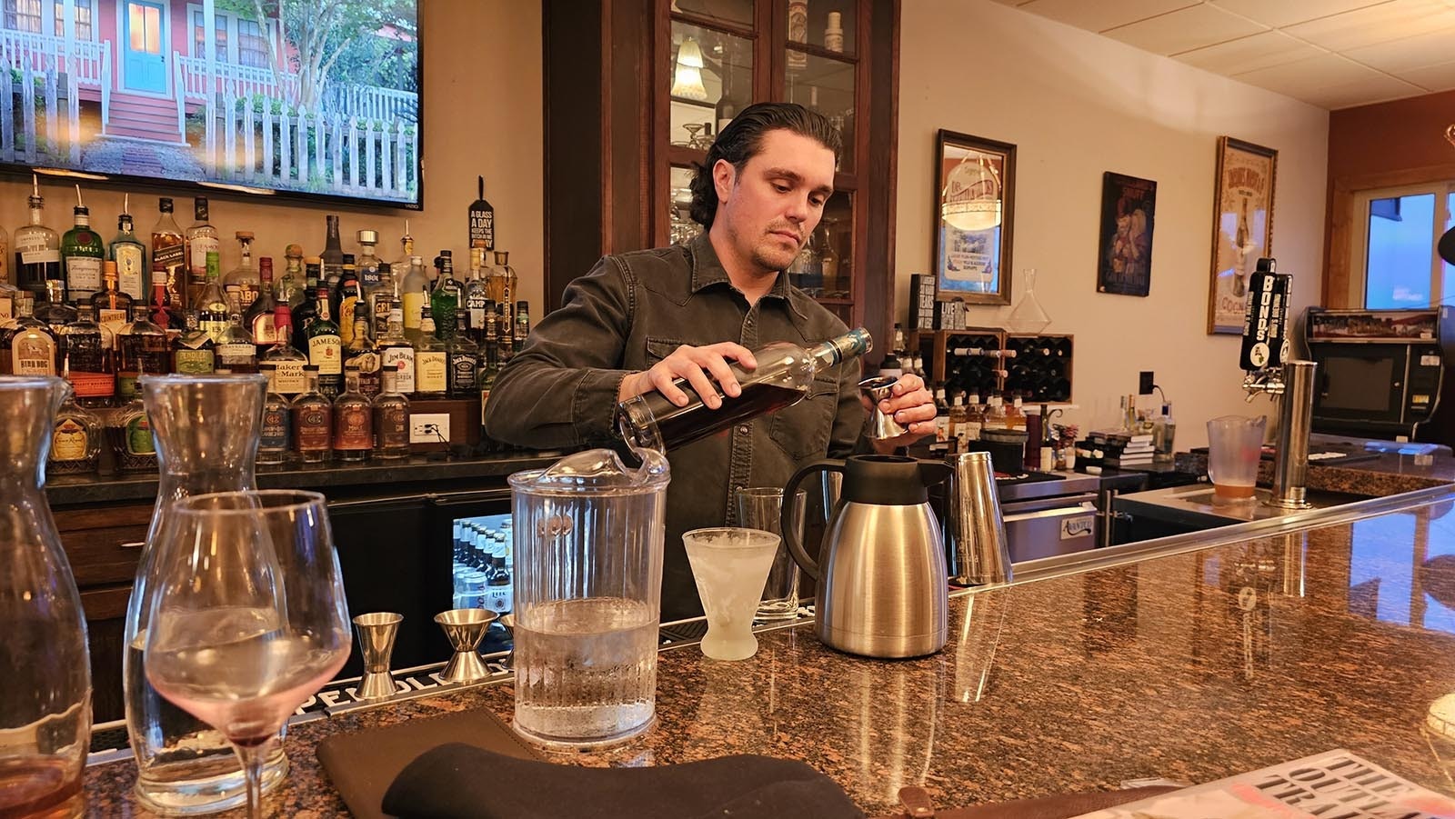 Bartender and front of the house manager Corey Colwell mixes up an espresso martini on the spot. Colwell was previously a general manager for Brush Creek Ranch, which is in Wyoming and is one of the most exclusive ranch stays in America.