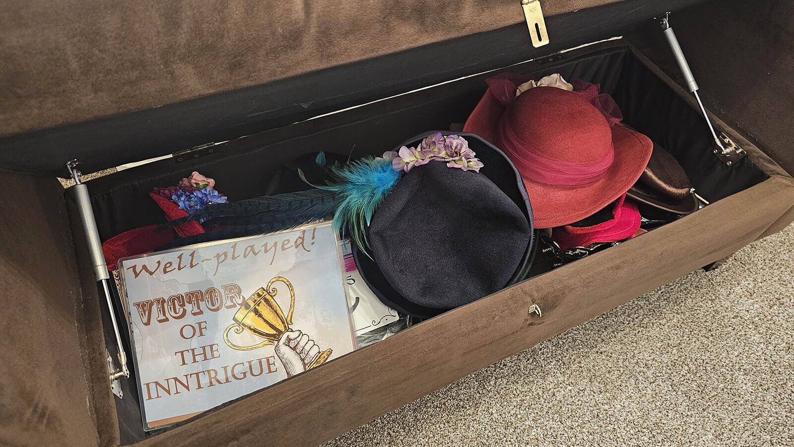 The ultimate puzzle leads to this treasure chest of hats and posters for an Inntrigue selfie.