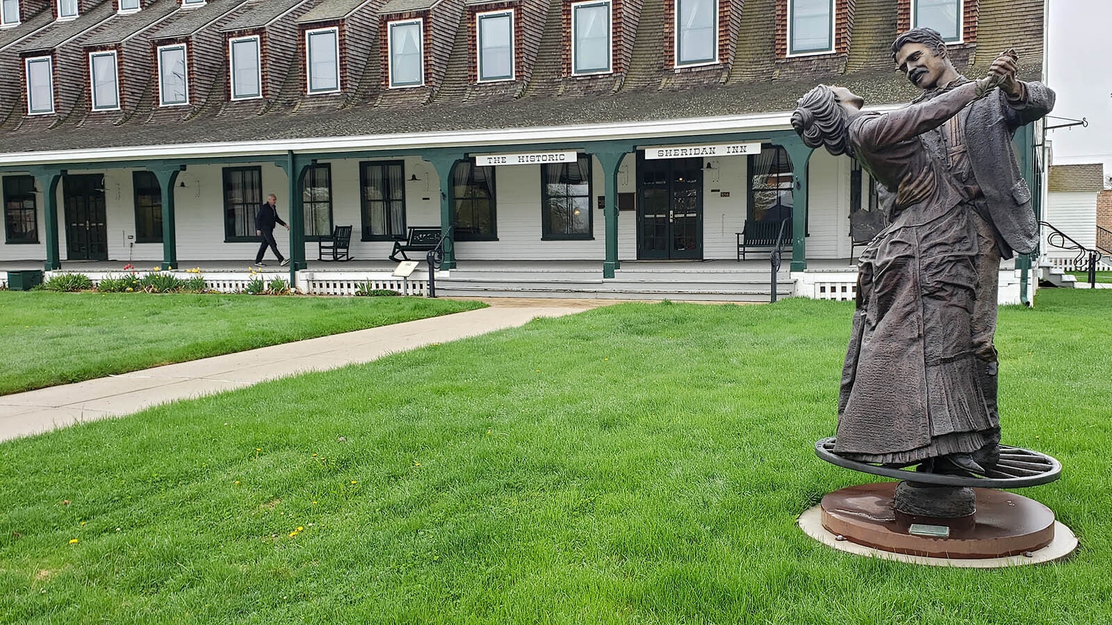 "The Dance" is a bronze sculpture on the front lawn of the Sheridan Inn that shows the high style of its historic heyday. The statue was commissioned in 2010.