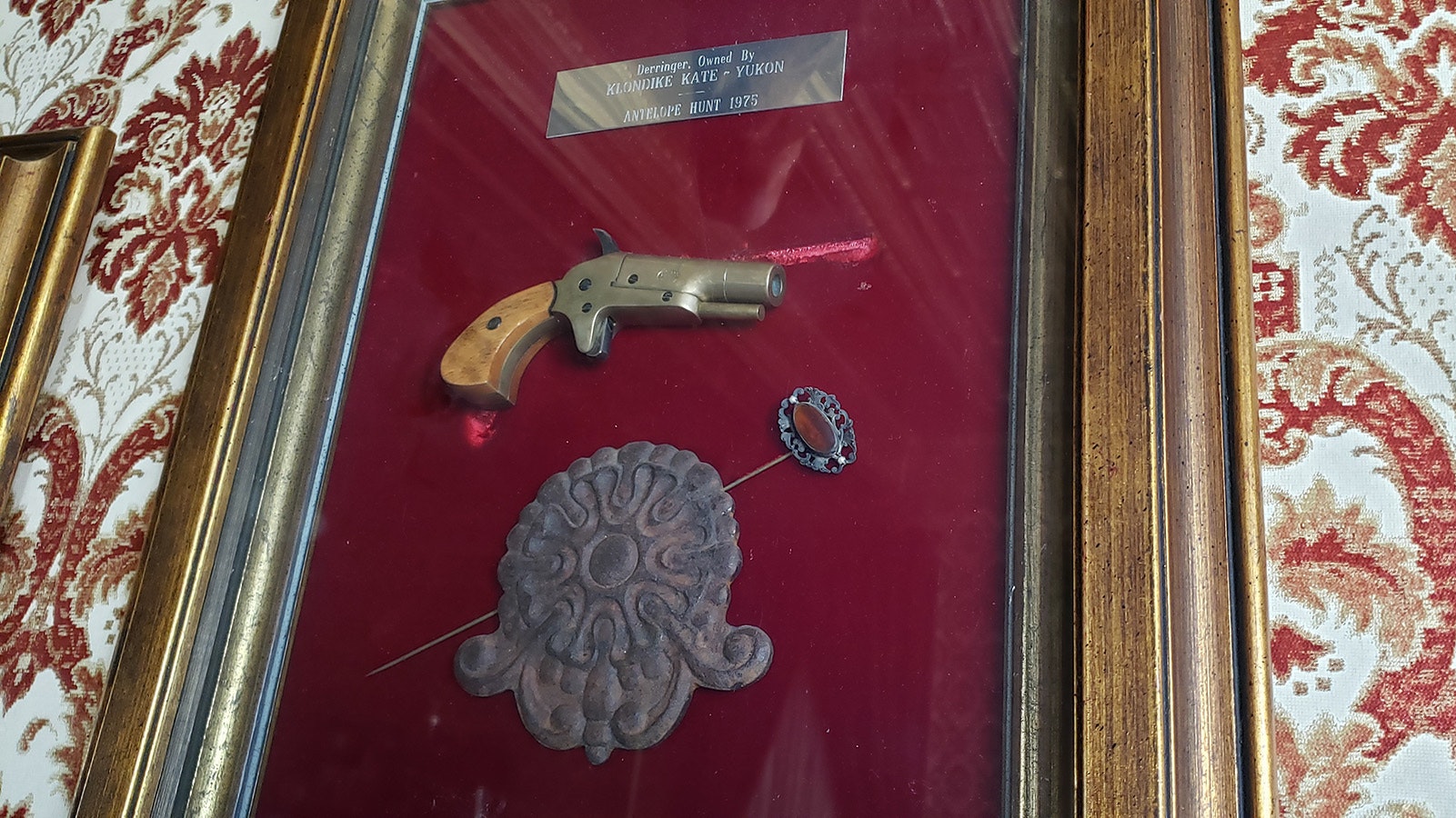 Klondike Kate's gun is under glass in the Owen Wister Dining Room at The Virginian.