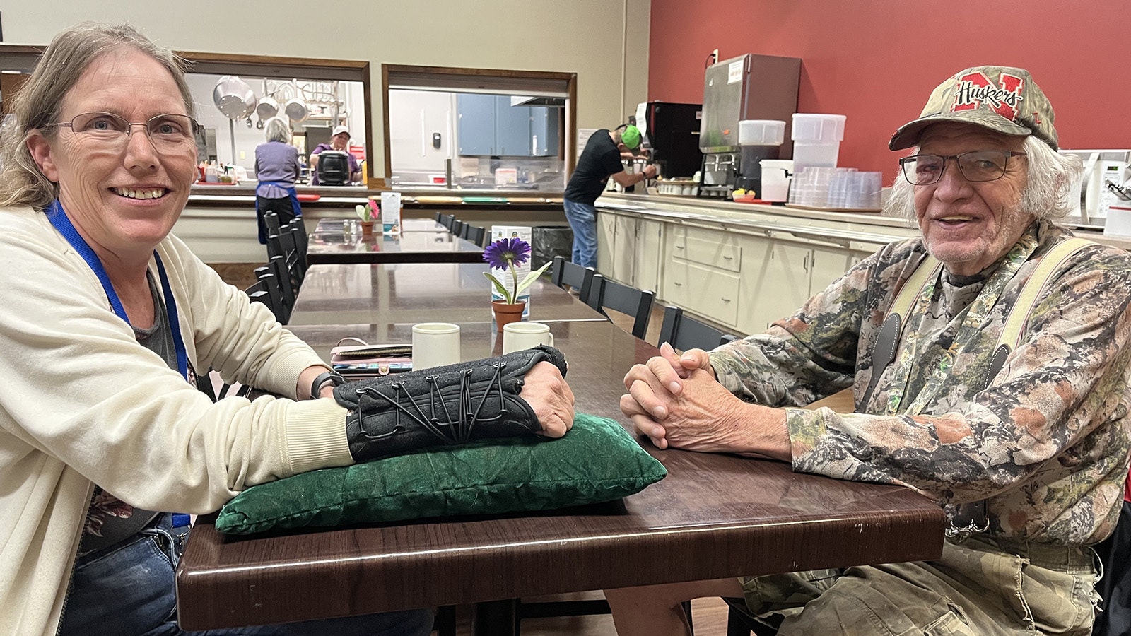 Dee Ownsby, left, chats with Bob Stephenson Friday at the Hot Springs Senior Citizen Center. They both said Sgt. Mike Mascorro is a great cop and should be on active duty for the Thermopolis Police Department.