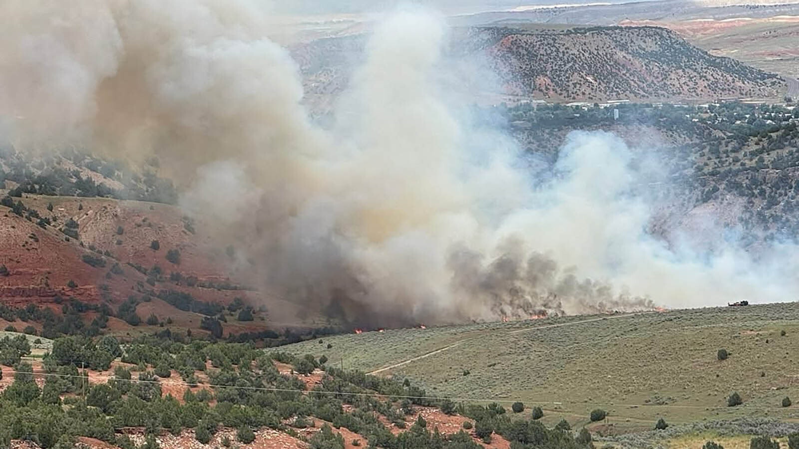 The Coyote Run Fire with the town of Thermopolis a mile away in the background. The 175-acre fire doesn't pose any threat to the town, but the situation could be changed if lightning from afternoon thunderstorms sparks new fires.