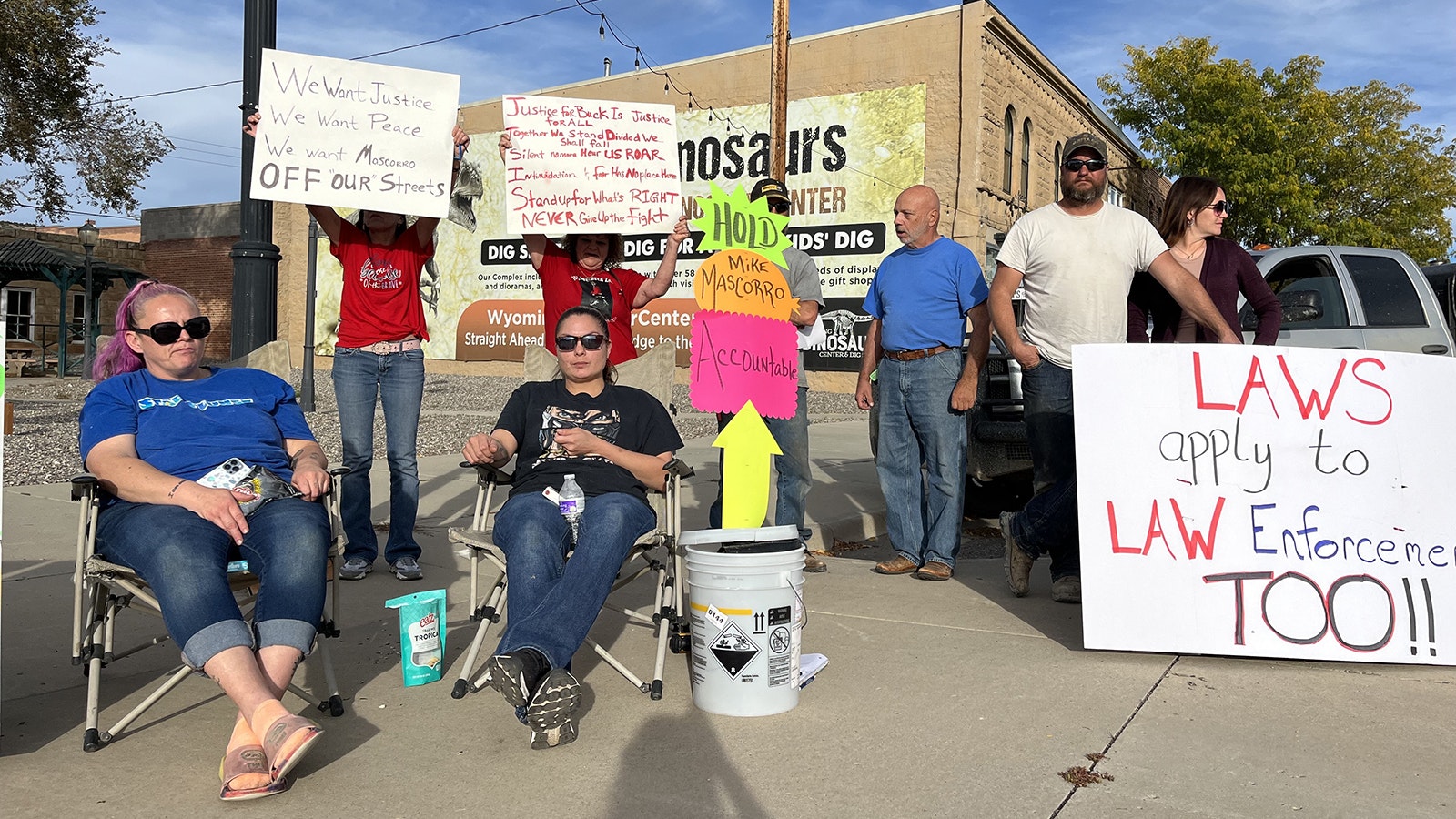 Jason Bowman, right in white T-shirt, led roughly a dozen protestors Monday in Thermopolis, urging the town to hold police Sgt. Mike Mascorro responsible for entering a man’s home illegally April 28 and triggering a gunfight that led to the man’s death.