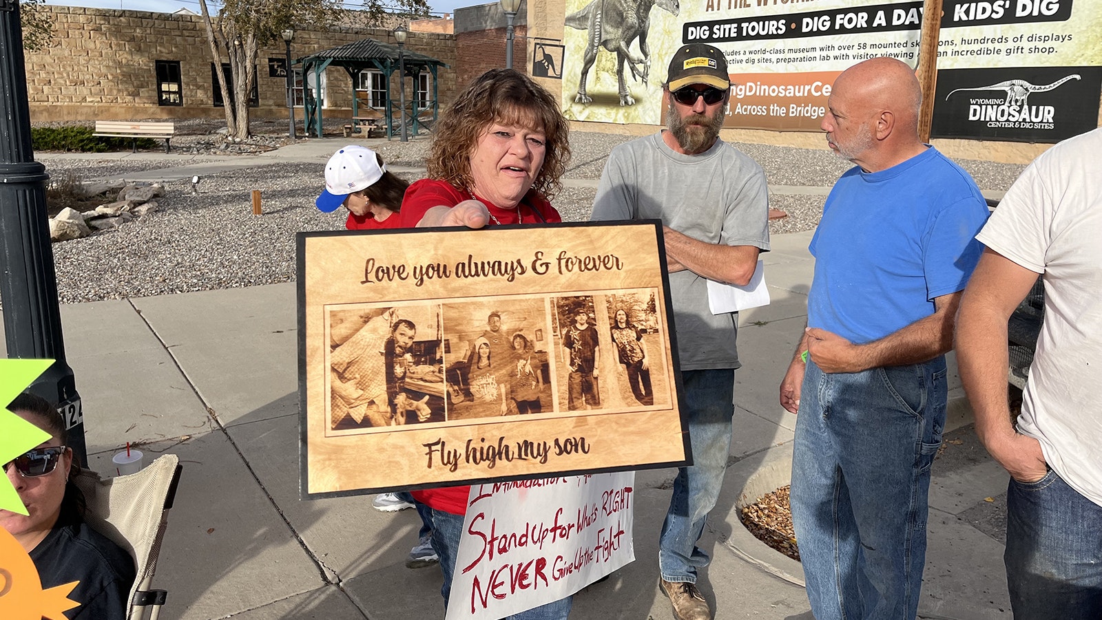 Debra Laramore-Fenton, mother of Buck Laramore, who was killed in a shootout with a Thermopolis police officer, holds a sign memorializing her son at a Monday protest. A special prosecutor determined that while the officer was justified in shooting Laramore, he did so after entering his house illegally.