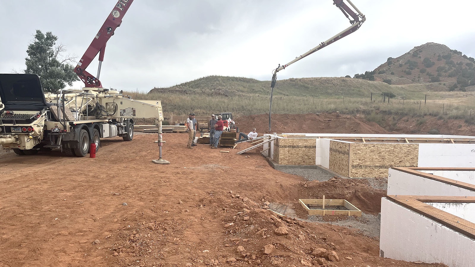 Concrete is poured to create the foundations for a series of housing units that will be used to help attract teachers to Thermopolis.