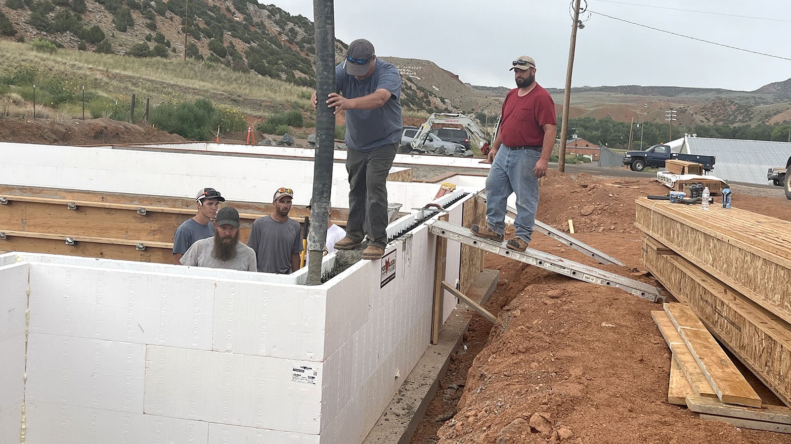 Jared Jeffs mans the cement hose in what will be the Hot Springs County School District’s first teacherage, a product of maintenance crew, student gumption and vision from school leaders.