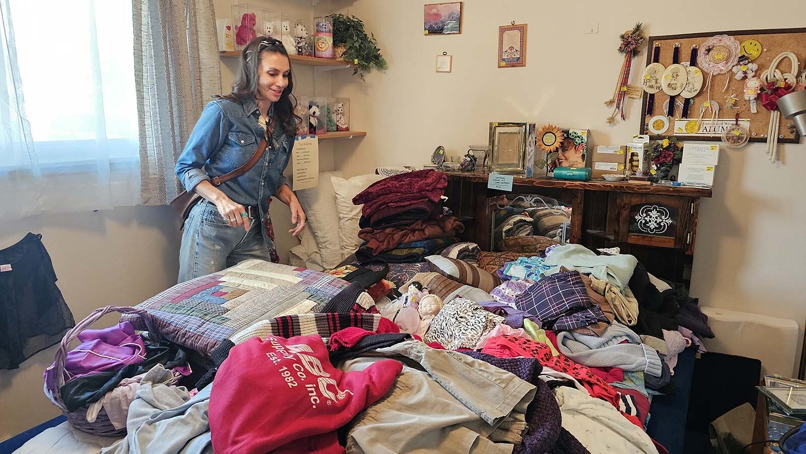 Piles of random clothing on a bed often don't have much competition for Macradee Aegerter, who is looking for vintage clothing items that were made in America, back when making things to last was still important.