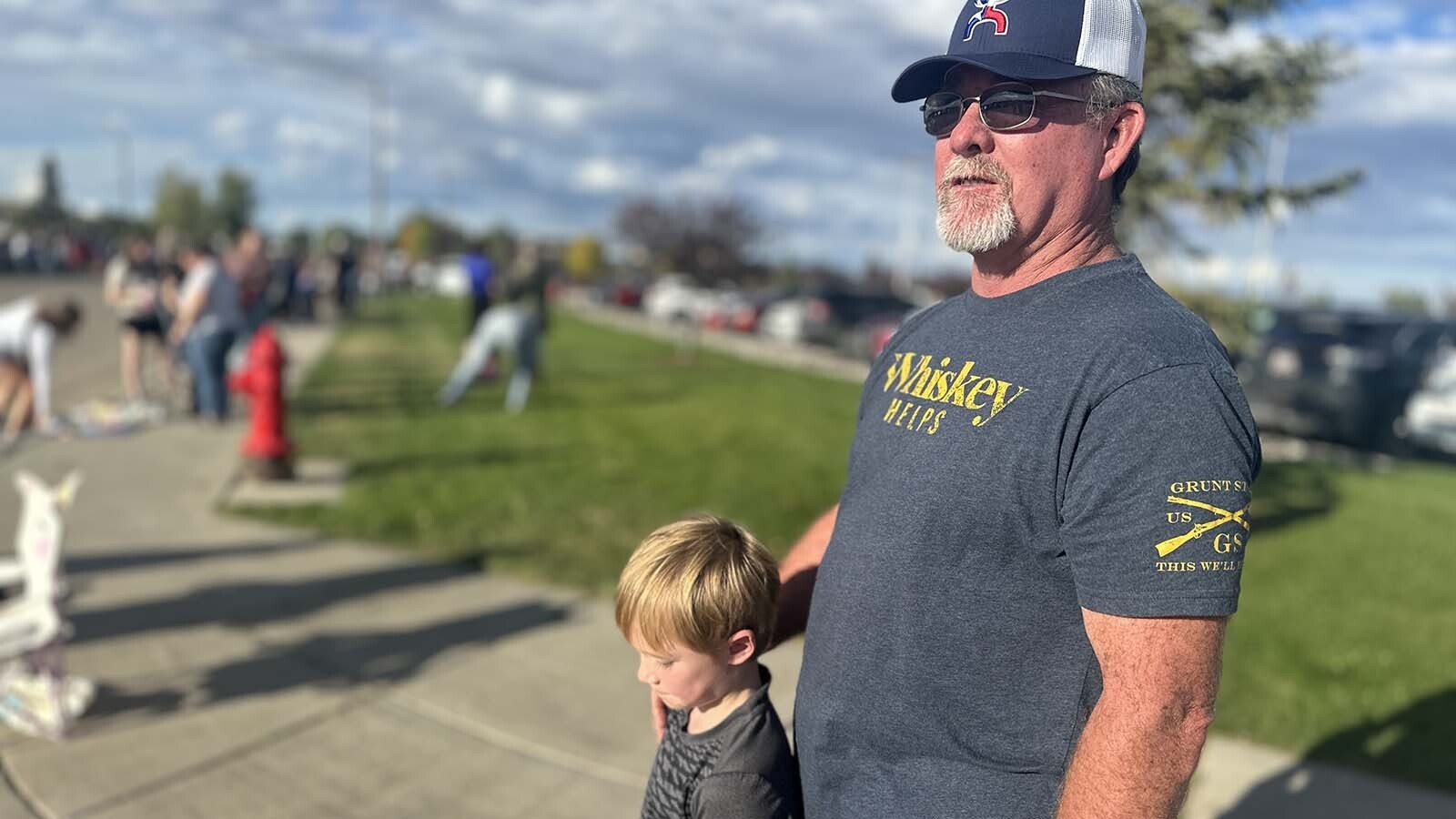 Don and Brooks Madsen join in the multi-generational celebration of school spirit.