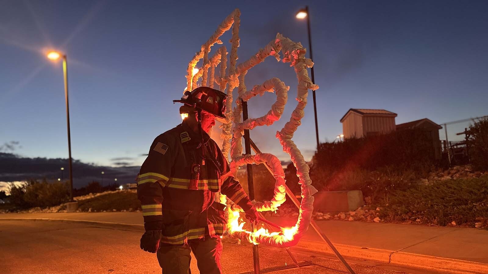 Campbell County Fire Captain Robert Dickey prepares and lights up the Thunder Basin High School initials for homecoming.