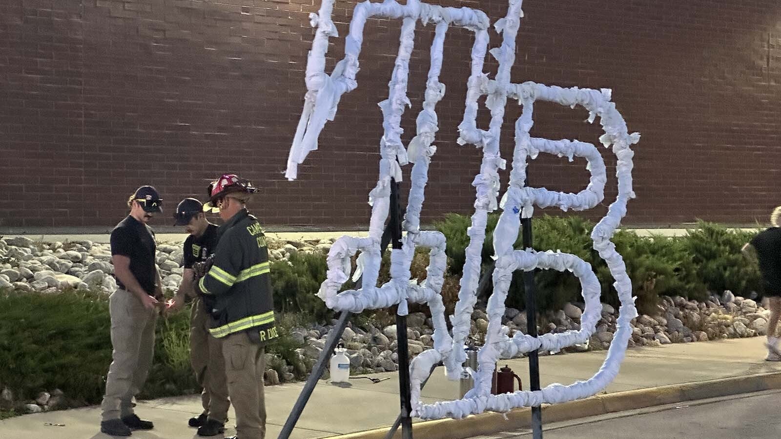 Campbell County Fire Captain Robert Dickey prepares and lights up the Thunder Basin High School initials for homecoming.