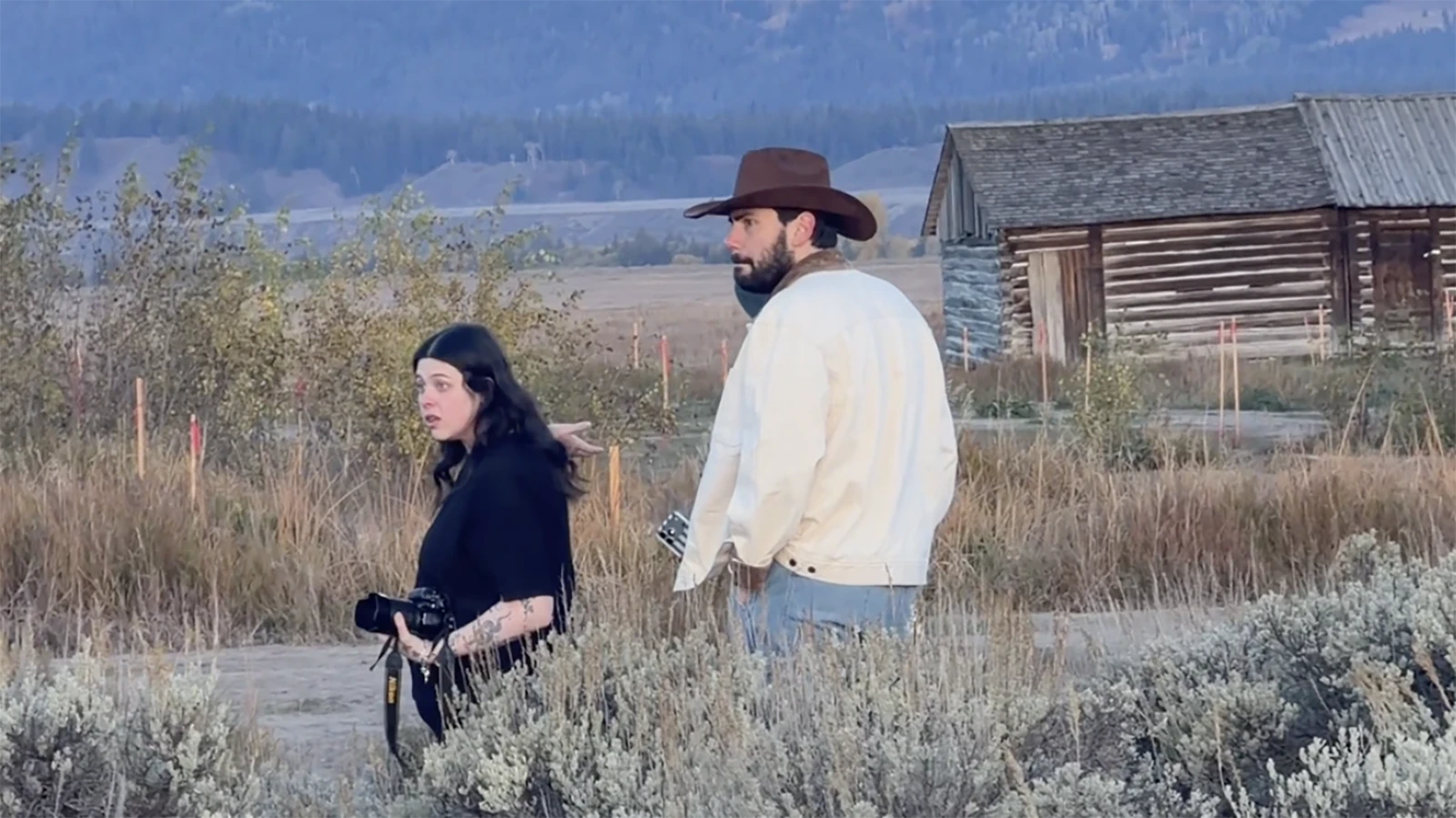 A screenshot from the original TikTok by ISA KNOWS, which shows Megan Pope confronting a line of tourist photographers at Mormon Row in Grand Teton National Park.