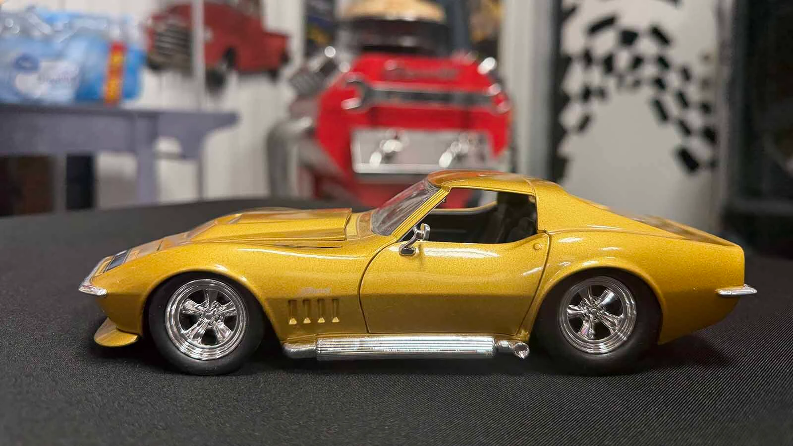 Ed Downes of Douglas is the brainchild behind the miniature car show and has replicas of all his life-sized cars, including his favorite gold 1969 Corvette Stingray.