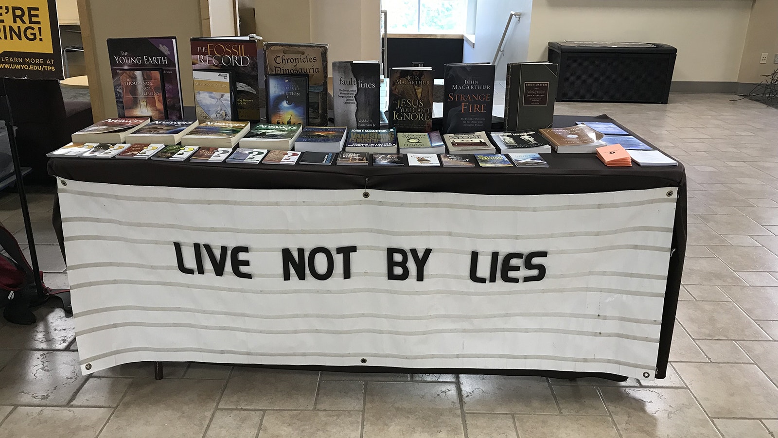 Laramie evangelist Todd Schmidt presents a table at the University of Wyoming Student Union every Friday. The sign on the front of his table usually has a different religious-based message.