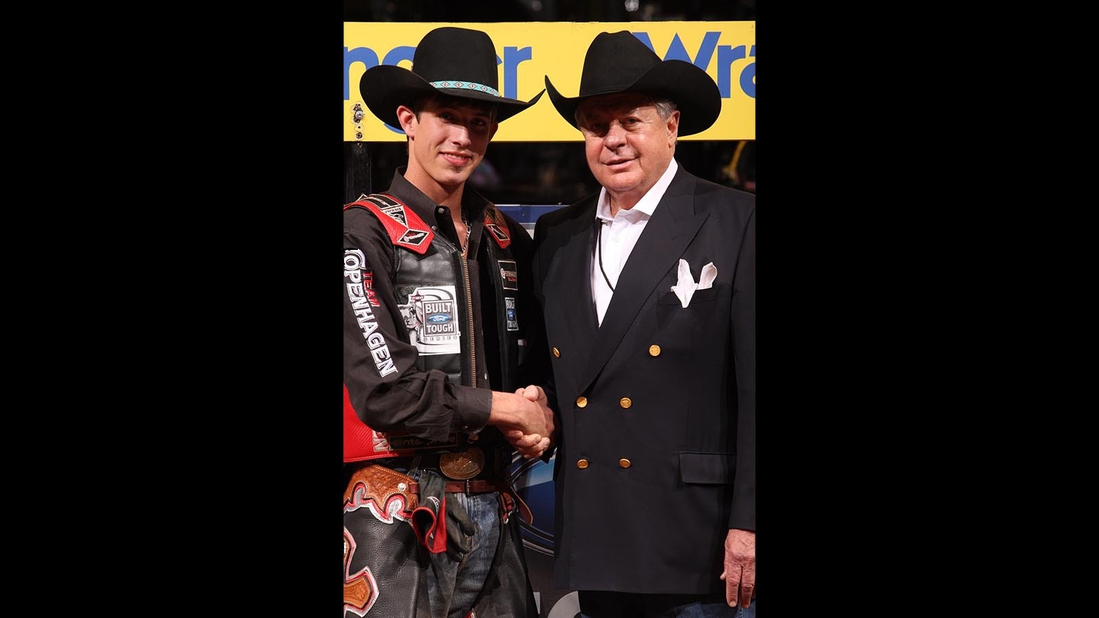 Tom Teague, right, contragulates JB Mauney for being the first to cover Bones in 2009.