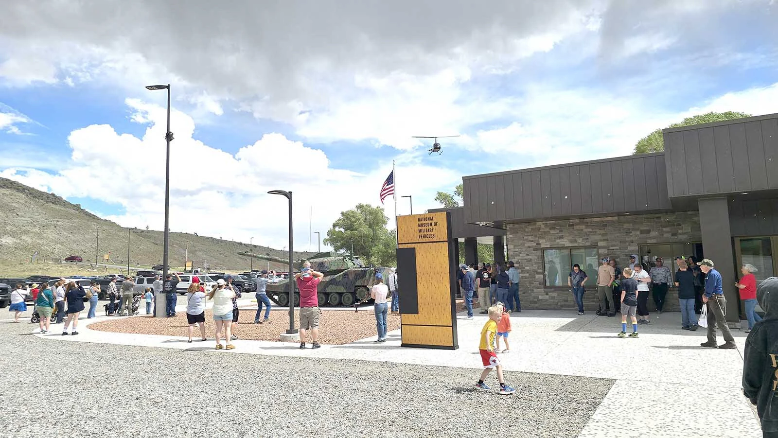 A helicopter comes in to drop Tootsie Rolls at the National Museum of Military Vehicles.