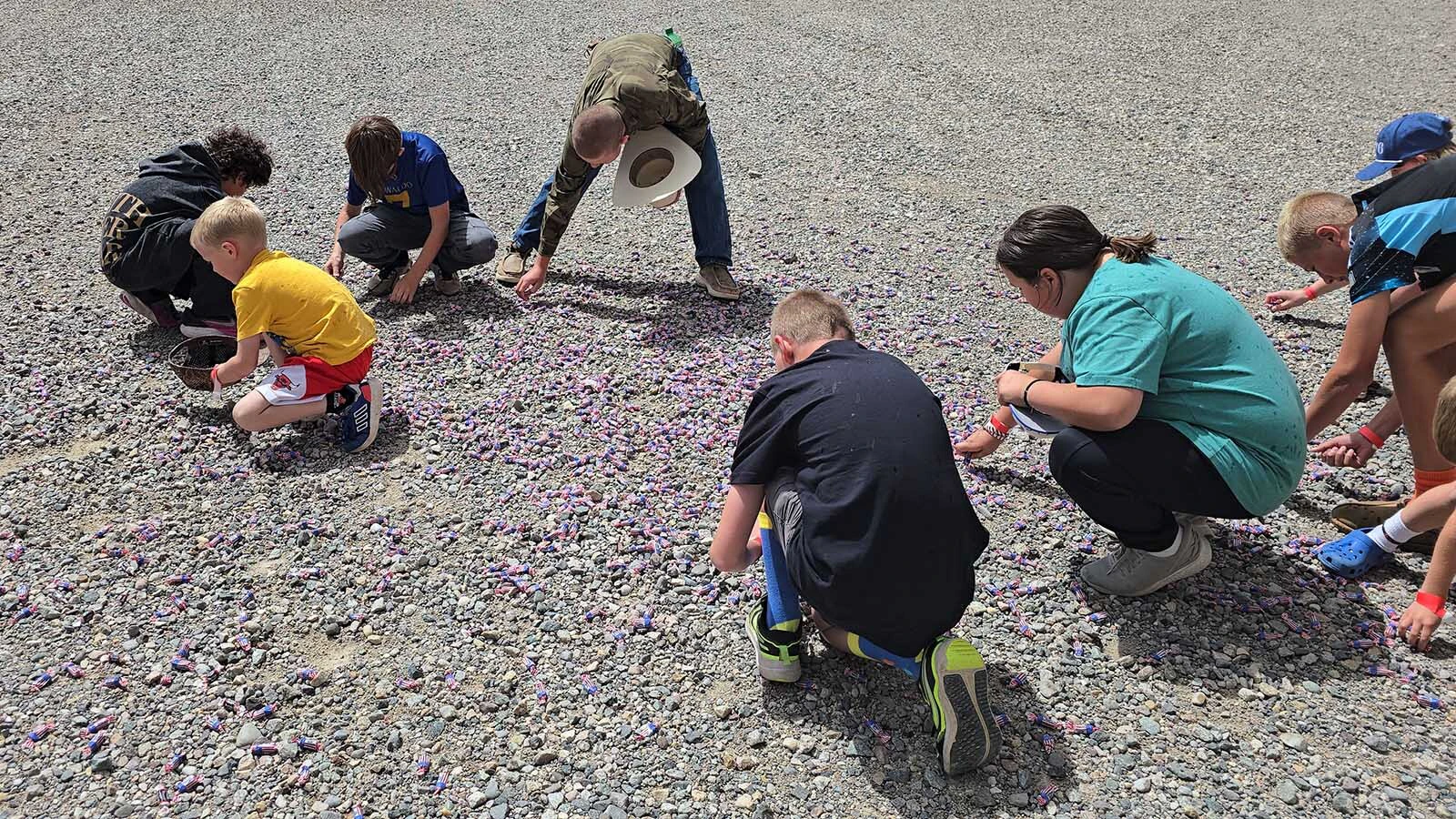 Children at the National Museum of Military Vehicles picked up Tootsie Rolls as fast as they could.