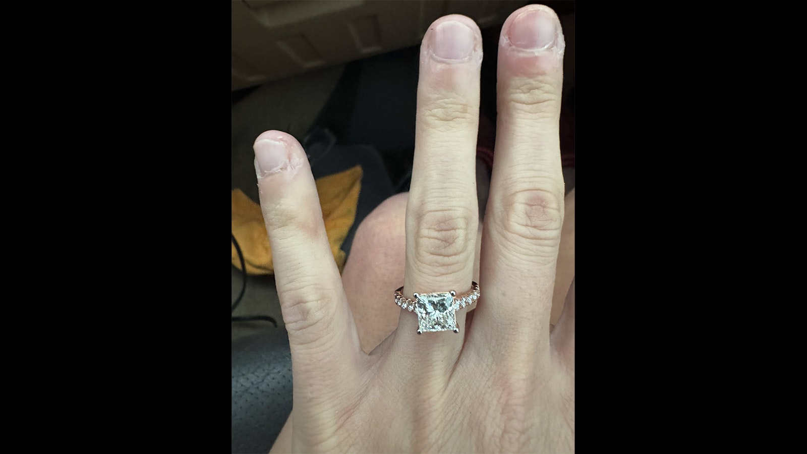 Paige Berdomas shows the engagement ring she got from fellow storm chaser Bryce Shelton.
