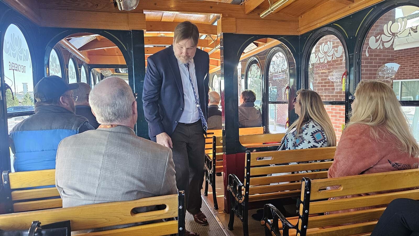 Wyoming Hospitality and Travel Coalition Executive Director Chris Brown boards a Cheyenne trolley with other members of the Wyoming Hospitality and Travel Coalition, for a show of friendly force at the state Capitol during the two-day Wyoming Governor's Hospitality & Tourism Convention in Cheyenne.