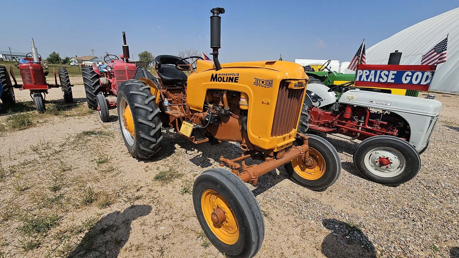The Minneapolis Moline is brown and gold, making it a perfect UW tractor for parades.