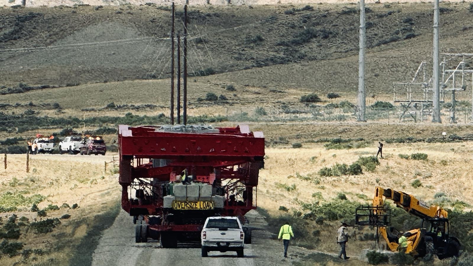 The 375-foot-long specialized heavy truck and trailer carrying a transformer for installation at PacifiCorp’s Aeolus substation, stops just in front of the substation before it is unloaded.