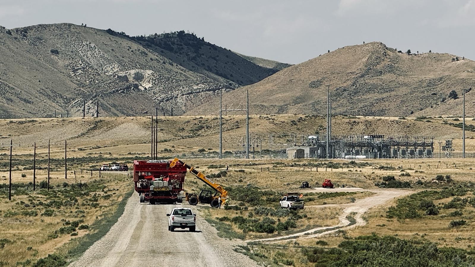 The 375-foot-long specialized heavy truck and trailer carrying a transformer for installation at PacifiCorp’s Aeolus substation, stops just in front of the substation before it is unloaded.